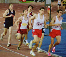 Mike Gulotta, history sophomore, second from left rounds the bend as part of the pack in a meet last year.