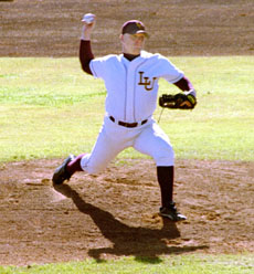 Ryan Mahoney, general business junior, hurls a pitch from the mound in the loss against SUNO.