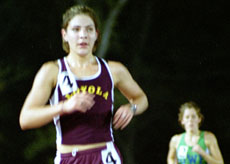 Natalie Sargent, general studies freshman, outpaces the competition at Tad Gormley Stadium. 