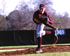 Scott Schenck, management junior, follows through on a pitch during a game at Barrow Stadium.  