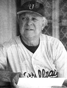 Coach Don Moreau studies the lineup during a game in 1999