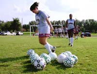 Communications senior and co-captian Lisa Lester practices on the side as the rest of the team looks on at the Â´Fly.