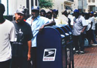 Homeless people from the Lafayette Square area line up to receive their free lunches from Loyola students through LUCAP’s Hunger Relief program.