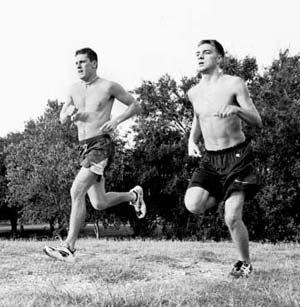 Joe Kutner, computer information systems and music junior, and Nick Bousquet, business marketing freshman, run across the ’Fly at practice.