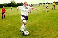 Lissa Lyncker, biology junior, takes the ball up the field against Spring Hill at the ’Fly. The ’Pack went on to win the match 2-1 on a last-minute goal.