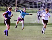 Goalkeeper Leila Manouchehri, sociology junior, clears a ball out of the box during a game against Spring Hill. The ’Pack has fallen to Spring Hill twice.