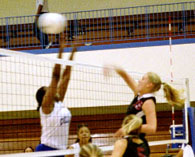 Marketing sophomore Shannon LaHaie goes up for the kill against Dillard in New Orleans.  The ’Pack went on to win the match.