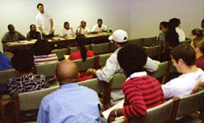 Students listen and participate during a Black Student Union meeting and discuss upcoming events.
