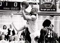 Marketing freshman James Olivard splits the defense and fights to the hoop during a game against Houston Baptist in the Den. Olivard scored eight points, shooting 50 percent from the field, during the opening home game.