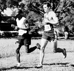 Kevin Fitzwilliam, communications senior, runs the course at the lakefront during Regionals.  The ’Pack went on to share the championship with Xavier.