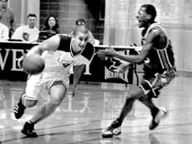 General business sophomore Matt Truax drives into the lane against Houston Baptist in the Den during the home opener.  The ’Pack fell to the Huskies, 96-78.