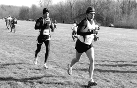 Joe Kutner [back], computer information systems and music senior, takes the cold in stride. Kutner was one of two Loyola runners who are Wisconsin natives.