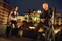 Elektra Natchios (Jennifer Garner) clashes with Bullseye (Colin Farrell) on a rooftop. Farrell stands out in his role as one of the villains out to get Daredevil.