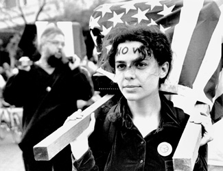 Karen O’Keefe, a third year law student at Loyola, carries a coffin in the protest of the war in Iraq.  The protest held after the first day of bombing caused mixed reactions from onlookers.