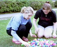Monet Brewerton,general studies freshman, and Diane Farner, biology freshman. [left to right] count their haul after an Easter egg hunt in the Peace and Academic Quads on Friday, April 11.