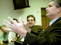 WVUE news director Keith Esperes, right, explains his opinion as Times-Picayune managing editor Peter Kovacs and other members of the panel look on during the presentation April 29 in the communications/music building.