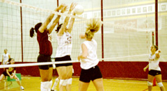 Marketing junior Shannon LaHaie spikes the ball in a drill as chemistry pre-med junior Ashley Cobette and international business junior Lauren Landry attempt to block. The 2003 volleyball team opens play today in Livingston, Ala. The ’Pack will play four games over the weekend.