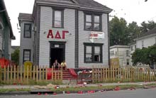 Alpha Delta GammaÂ´s house on Freret Street. Saturday afternoon the yard and nearby areas were trashed with red cups after their annual Red Tide Party. 