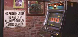 A sign in MollyÂ´s at the Market, a French Quarter bar, warns underage patrons not to play the video poker machines. The machines are common in many local bars, but anyone under 21 could be fined or arrested if theyÂ´re caught playing.