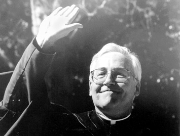 Bernard Knoth greets the crowd at his inauguration in November 1995. Knoth was the first president in Loyola history to have an official ceremony for his installation to the office.