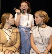 Mary Tilford (Kristi Jacobs) terrorizes Karen Wright (Kim Lucas) and Martha Dobie (Gwenevere Sisco) in ‘The Children’s Hour.’