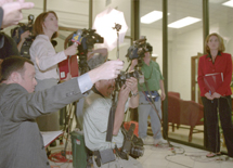 Local television and newspaper reporters gather outside the Office of the President in Marquette Hall Tuesday afternoon for a press conference on Knoth’s resignation.