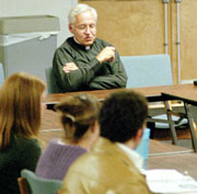 Former university president the Rev. Bernard Knoth, S.J., meets with Student Government Association leaders in February 2002 regarding graduation changes. 