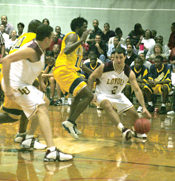 English writing senior Jonathan Hernandez drives to the basket as economics senior Mike Senna clears the way against Oakwood College on Nov. 8. The Â´Pack won the game 78-66 in the Den.
