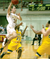 Finance sophomore Daniel Schmidt moves the ball down the court against two Oakwood defenders on Saturday.