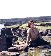 Katie Grace lounges on a rocky cliff on Aran Islands near Galway.