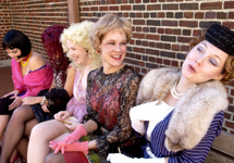 The ladies of "The Oldest Profession" sit on a bench reminiscing about gentlemen and their days in New Orleans.  