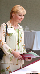 Anna Nuessle registers for Family Weekend in the St. Charles Room.