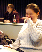 Psychology senior Melissa Allen and communications senior Sandra Barnhart watch the movie "9 to 5" hosted by AKPsi. 