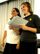 Management senior Bea Forlano, former SGA president, and sociology senior Mary Grace Stewart, former SGA vice president, hand out certificates of appreciation to congresspeople during their final meeting Tuesday night.