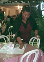 Waitress Gina Lang clears the table at DunbarÂ´s Creole Cooking on Freret Street. Patrons can enjoy the red beans and rice and chicken special for $5.99.