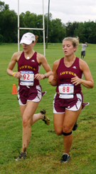 Natalie Sargent (left), sociology senior, runs alongside teammate Sarah Miles St. Claire, communications junior, in the Tulane Invitational Sept. 3 at Gretna Park. Sargent said she was disappointed with her finish. She was LoyolaÂ´s top runner last year, finishing second in conference.