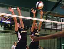 General studies freshmen Sarah Howard (left) and Alex Friedrichs, visual graphics freshman, jump to block a Xavier spike Tuesday in the Den. Loyola won the conference-opening match and will host Belhaven College tommorow. 
