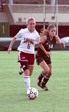 Kathryn Streeter, international business freshman, dribbles past a Belhaven defender Monday at TulaneÂ´s Westfeldt Facility. The Â´Pack fell to the Blazers 6-0.