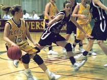 Joelle Bordelon, sociology senior, maneuvers to set up the offense around Campbellsville defenders Monday in the Den. The Â´Pack won 65-56.