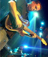 Guitarists Charlie Hitchcock (foreground) and Eric Gould (background) rock out while playing at the House of Blues last Sunday night.