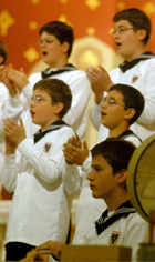 Members of the Vienna BoysÂ´ Choir sing last Sunday in Holy Name of Jesus Church.The choir, formed a little over 500 years ago, has never missed a Sunday Mass performance in its history. The boys performed several songs in their native language, German, before a packed crowd.