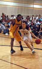 General studies freshman Luke Zumo dribbles past a Xavier defender in the Den. Zumo is part of the inaugural class of scholar athletes. The athletic scholarship experiment will continue with the basketball program for three years. Then it will be up to the Rev. Kevin Wildes, S.J., university president, to decide whether to continue the scholarships and if the other teams will receive any.