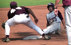 Management sophomore Brian Mason attempts to tag out a Mobile base runner Saturday at Segnette Field. In the three-game series Loyola lost the first and third games and won the second game making them 1-5 against Mobile.