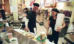 Cashiers Will Hammett and Sonny Mitchell work at PuccinoÂ´s on Magazine across the street from Rue De La Course.