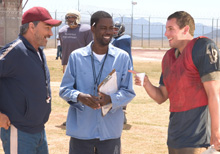 Â´The Longest YardÂ´ finds actors (from left to right) Burt Reynolds, Chris Rock and Adam Sandler working together to assemble a football team of convicts to play in a prison game against the prison guards. Rock said the remake is more of a comedy-action movie than the original, which was an action-comedy.