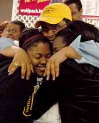 Daniel Green, political science junior, hugs friends after finding out that he was elected to be the new SGA president.