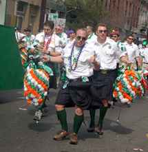 Participants in the Uptown St. PatrickÂ´s Day parade entertained the crowds by exchanging kisses for flowers last Saturday. Parades will continue this weekend in Metairie and the French Quarter.