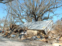 Trailers add to the rubble on top of DupontÂ´s parentÂ´s home in Gulfport, Miss.