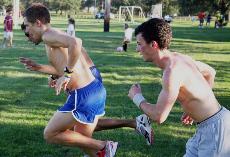 (From left to right) Finance senior Matt Cagigal, history senior Richard Bouckaert and marketing freshman Tyler Kaufman run laps at practice Tuesday.