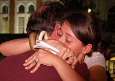 A Loyola student is embraced after speaking at the 15th annual Take Back the Night event last Wednesday. 